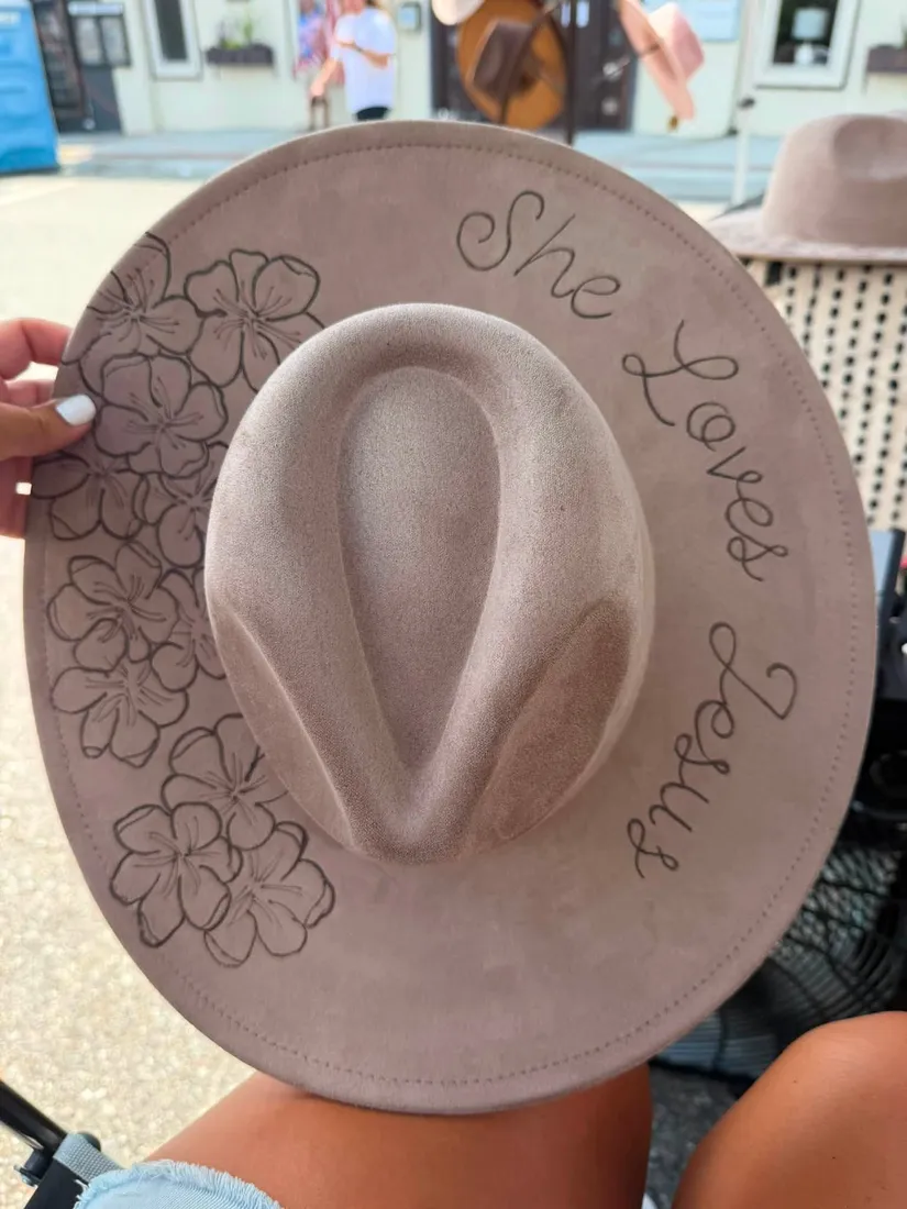 Faith and floral design hand-burned on a hat